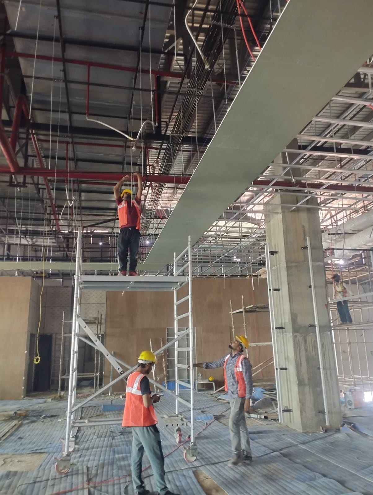 Interior fit-out beneath the completed steel frame